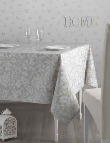 Mantel Antimanchas Palace. Estampado  hojas blancas fondo beige.